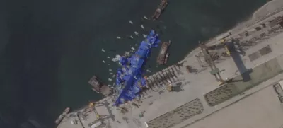 A satellite image shows a North Korean warship covered with a blue tarp after an accident that occurred during its launch at the shipyard in Chongjin, North Korea, May 24, 2025. 2025 Planet Labs PBC/Handout via REUTERS THIS IMAGE HAS BEEN SUPPLIED BY A THIRD PARTY. MANDATORY CREDIT. THIS IMAGE WAS PROCESSED BY REUTERS TO ENHANCE QUALITY.   TPX IMAGES OF THE DAY