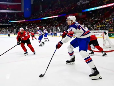 Ice Hockey - IIIHF World Championships - Final - Switzerland v United States - Avicii Arena, Stockholm, Sweden - May 25, 2025 Alex Vlasic of the U.S. in action with Switzerland's Nino Niederreiter Magnus Lejhall/TT News Agency via REUTERS   ATTENTION EDITORS - THIS IMAGE WAS PROVIDED BY A THIRD PARTY. SWEDEN OUT. NO COMMERCIAL OR EDITORIAL SALES IN SWEDEN.