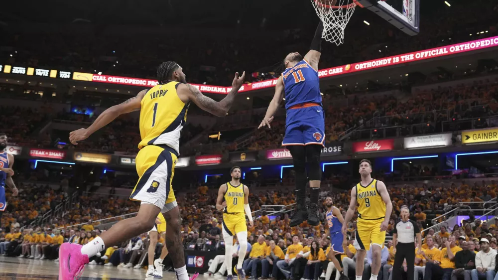 New York Knicks guard Jalen Brunson (11) shoots against the Indiana Pacers during the second half of Game 3 of the Eastern Conference finals of the NBA basketball playoffs Sunday, May 25, 2025, in Indianapolis. (AP Photo/AJ Mast)