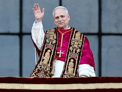 FILE PHOTO: Pope Leo XIV gestures at the balcony of Basilica di San Giovanni in Laterano (Basilica of St. John Lateran) after celebrating Mass, in Rome, Italy, May 25, 2025. REUTERS/Vincenzo Livieri/File Photo