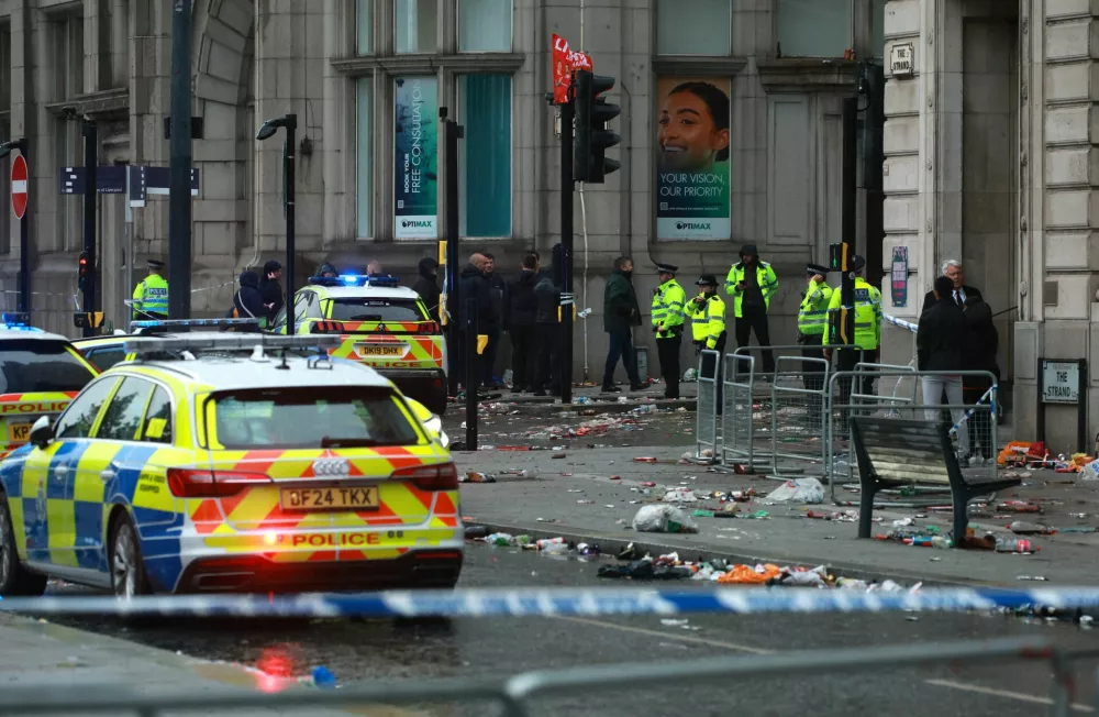 Soccer Football - Premier League - Liverpool Victory Parade - Liverpool, Britain - May 26, 2025 Emergency services at the scene after multiple people were hit by a car during the Victory parade REUTERS/Phil Noble