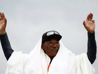 FILE PHOTO: Kami Rita Sherpa, 53, a Nepali mountaineer, waves towards the media personnel upon his arrival after climbing Mount Everest for the 28th time, creating a new record for the most summits of the world's highest mountain, in Kathmandu, Nepal May 25, 2023. REUTERS/Navesh Chitrakar/File Photo