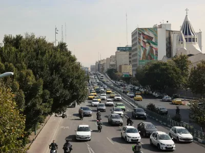 Cars pass on a street after several explosions were heard, in Tehran, Iran, October 26, 2024. Majid Asgaripour/WANA (West Asia News Agency) via REUTERS ATTENTION EDITORS - THIS IMAGE HAS BEEN SUPPLIED BY A THIRD PARTY