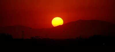 FILE PHOTO: The sun sets during a heatwave, in Mexicali, Mexico July 5, 2024. REUTERS/Victor Medina/File Photo