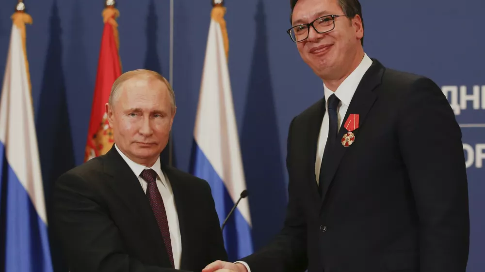 FILE - Russian President Vladimir Putin, left, shakes hands with Serbian President Aleksandar Vucic after being awarded the Order of Alexander Nevsky in Belgrade, Serbia, Thursday, Jan. 17, 2019. (AP Photo/Darko Vojinovic, File)