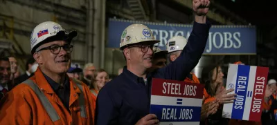 People listen as President Donald Trump speaks at U.S. Steel Corporation's Mon Valley Works-Irvin plant, Friday, May 30, 2025, in West Mifflin, Pa. (AP Photo/Julia Demaree Nikhinson)
