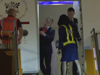 In this grab taken from video, France's President Emmanuel Macron prepares to disembark a plane on arrival, in Hanoi, Vietnam, Sunday, May 25, 2025. (AP Photo/Hau Dinh)