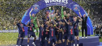 PSG players celebrate with the trophy after winning the Champions League final soccer match between Paris Saint-Germain and Inter Milan at the Allianz Arena in Munich, Germany, Saturday, May 31, 2025. (AP Photo/Matthias Schrader)
