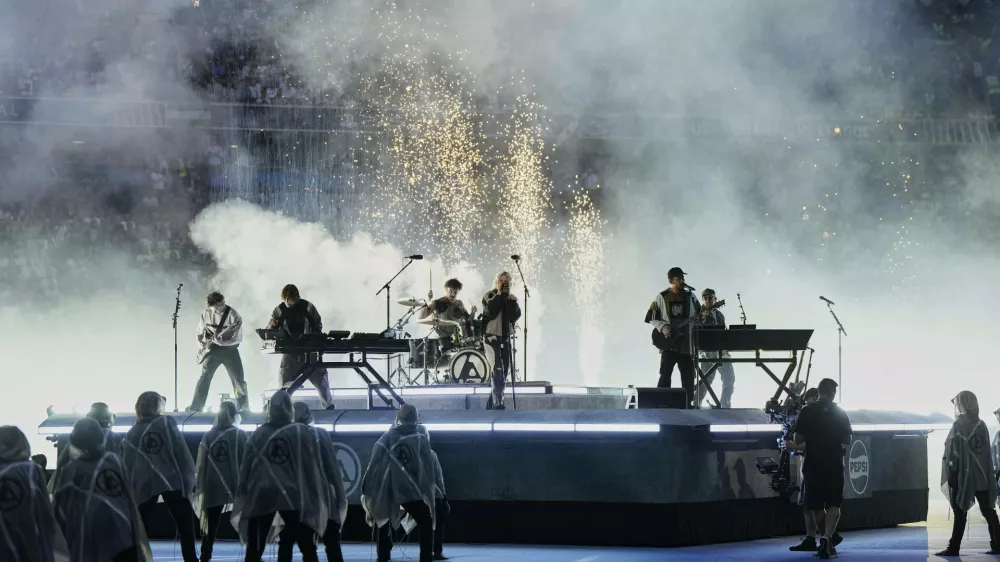Linkin Park performs before the Champions League final soccer match between Paris Saint-Germain and Inter Milan at the Allianz Arena in Munich, Germany, Saturday, May 31, 2025. (AP Photo/Martin Meissner)