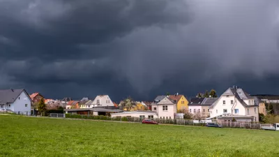 Storm clouds over a village