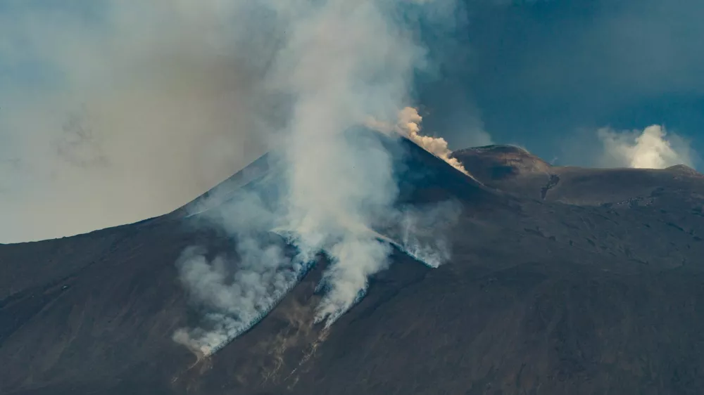 A drone view shows volcanic steam and ash rising from Mount Etna, as seen from Milo, Italy, June 2, 2025. REUTERS/Giuseppe di Stefano