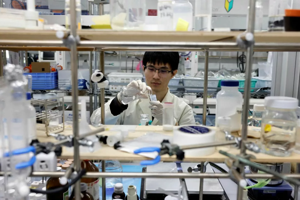 A researcher demonstrates the process of compounding the ocean-degradable plastic raw materials at the Center for Emergent Matter Science (CEMS) of Japanese research institution Riken in Wako, Saitama Prefecture, Japan May 27, 2025. REUTERS/Manami Yamada