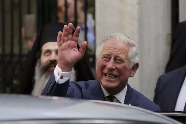 FILE - In this Thursday, May 10, 2018 file photo, Britain's Prince Charles, waves as he leaves a meeting with the head of Greece's Orthodox Church Archbishop Ieronymos, in Athens. Kensington Palace announced on Friday, May 18, 2018 Prince Charles will walk Meghan Markle down the aisle in her wedding to Prince Harry. (AP Photo/Petros Giannakouris)