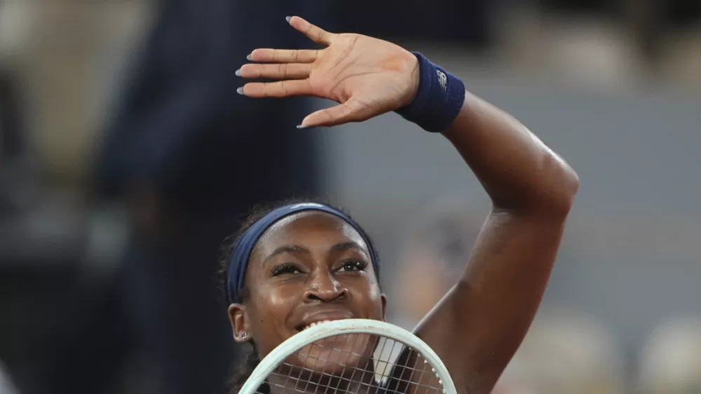 Coco Gauff of the U.S. celebrates as she won the semifinal match of the French Tennis Open against France's Lois Boisson at the Roland-Garros stadium in Paris, Thursday, June 5, 2025. (AP Photo/Lindsey Wasson)