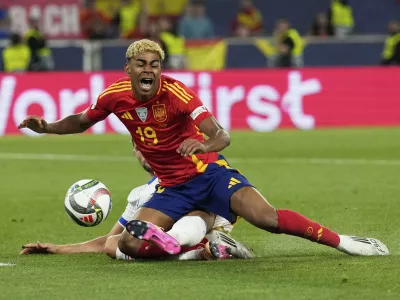 France's Adrien Rabiot fouls Spain's Lamine Yamal inside the penalty box during the Nations League semifinal soccer match between Spain and France in Stuttgart, Germany, Thursday, June 5, 2025. (AP Photo/Matthias Schrader)