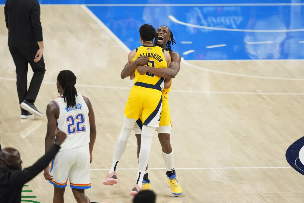 Jun 5, 2025; Oklahoma City, Oklahoma, USA; Indiana Pacers forward Aaron Nesmith (23) and guard Tyrese Haliburton (0) celebrate after a play against the Oklahoma City Thunder during the fourth quarter in game one of the 2025 NBA Finals at Paycom Center. Mandatory Credit: Kyle Terada-Imagn Images