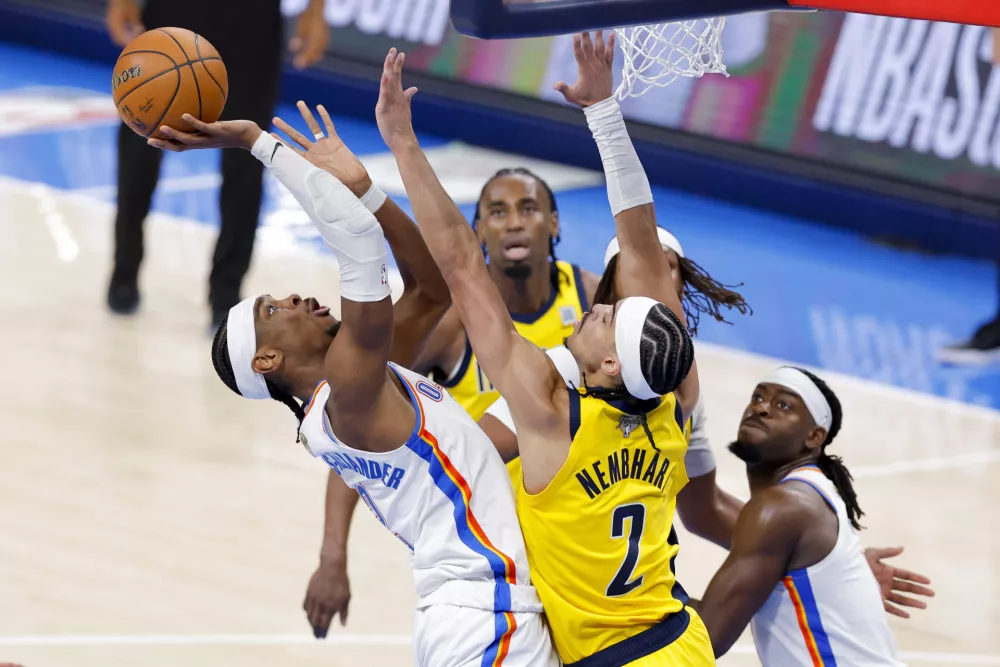 Jun 5, 2025; Oklahoma City, Oklahoma, USA; Oklahoma City Thunder guard Shai Gilgeous-Alexander (2) shoots the ball over Indiana Pacers guard Andrew Nembhard (2) during the fourth quarter during game one of the 2025 NBA Finals at Paycom Center. Mandatory Credit: Alonzo Adams-Imagn Images