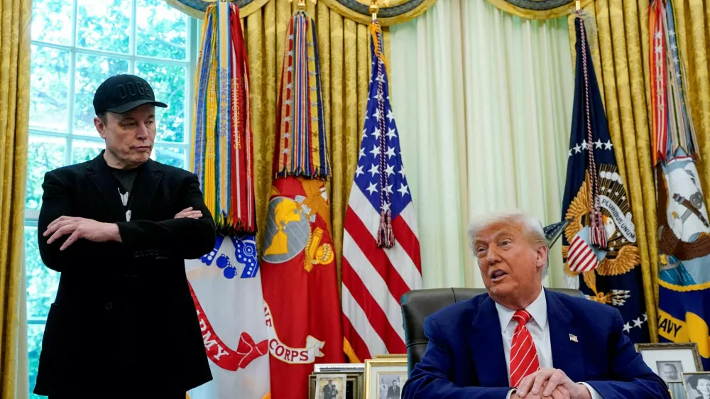 FILE PHOTO: U.S. President Donald Trump and Elon Musk attend a press conference in the Oval Office of the White House in Washington, D.C., U.S., May 30, 2025. REUTERS/Nathan Howard/File Photo