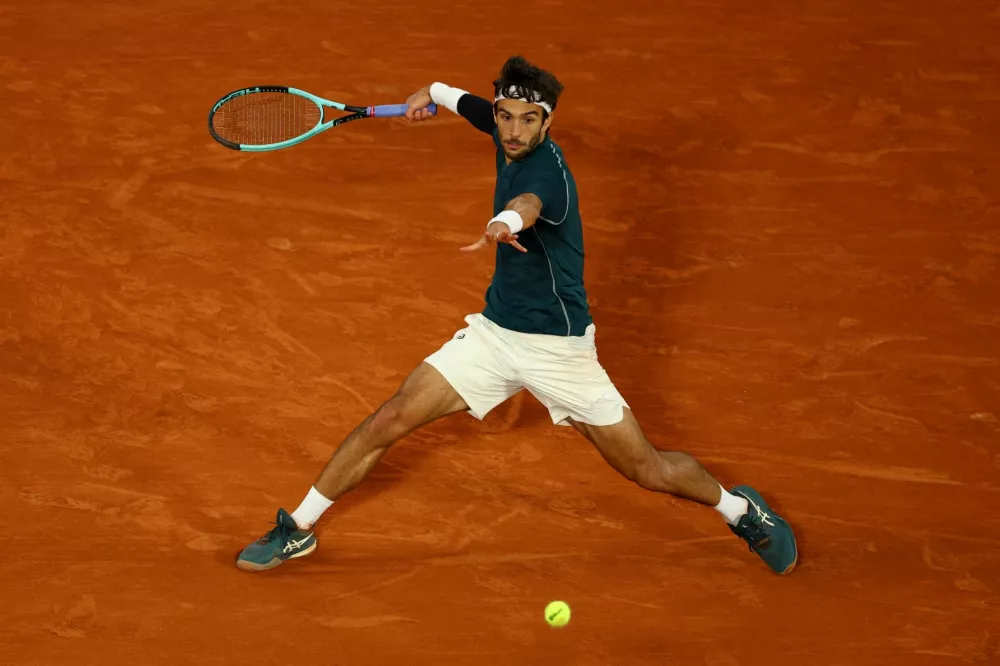 Tennis - French Open - Roland Garros, Paris, France - June 6, 2025 Italy's Lorenzo Musetti in action during his semi final match against Spain's Carlos Alcaraz REUTERS/Lisi Niesner