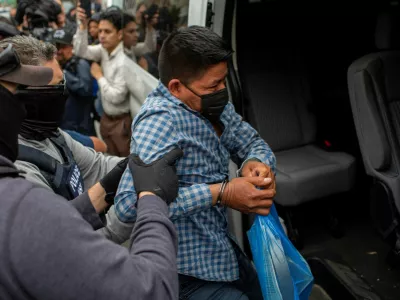 A man is loaded into a passenger van by federal agents after the agents made immigration arrests in Chicago, Illinois, U.S. June 4, 2025. REUTERS/Jim Vondruska   TPX IMAGES OF THE DAY