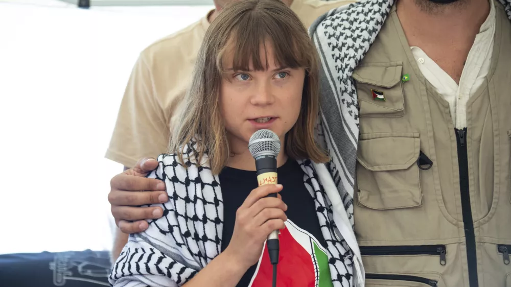 Climate activist Greta Thunberg with other activists from a human rights organization meets with journalists in Catania, Italy, Sunday, June 1, 2025, ahead of their departure for the Mideast. (AP Photo/Salvatore Cavalli)