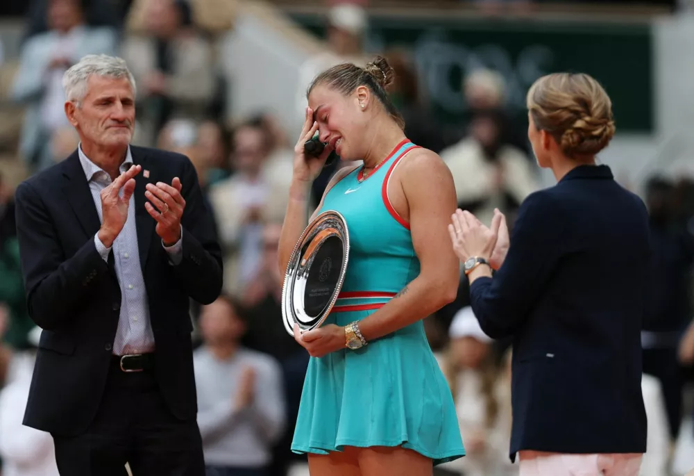 Tennis - French Open - Roland Garros, Paris, France - June 7, 2025 Belarus' Aryna Sabalenka poses with the runner up trophy after her women's singles final against Coco Gauff of the U.S. REUTERS/Gonzalo Fuentes