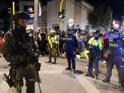 Police stand guard outside the Medicentro hospital where Colombian senator and presidential candidate Miguel Uribe Turbay is being treated after he was shot during a campaign rally in Bogota, Colombia, Saturday, June 7, 2025. (AP Photo/Jhon Wilson Vizcaino)