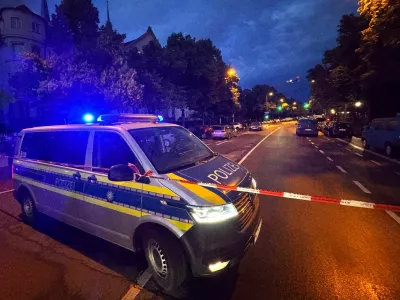 A police car secures the area where police responded with firearms to a woman who injured several passers-by with a knife, in Munich, Germany, June 7, 2025. REUTERS/Christine Uyanik