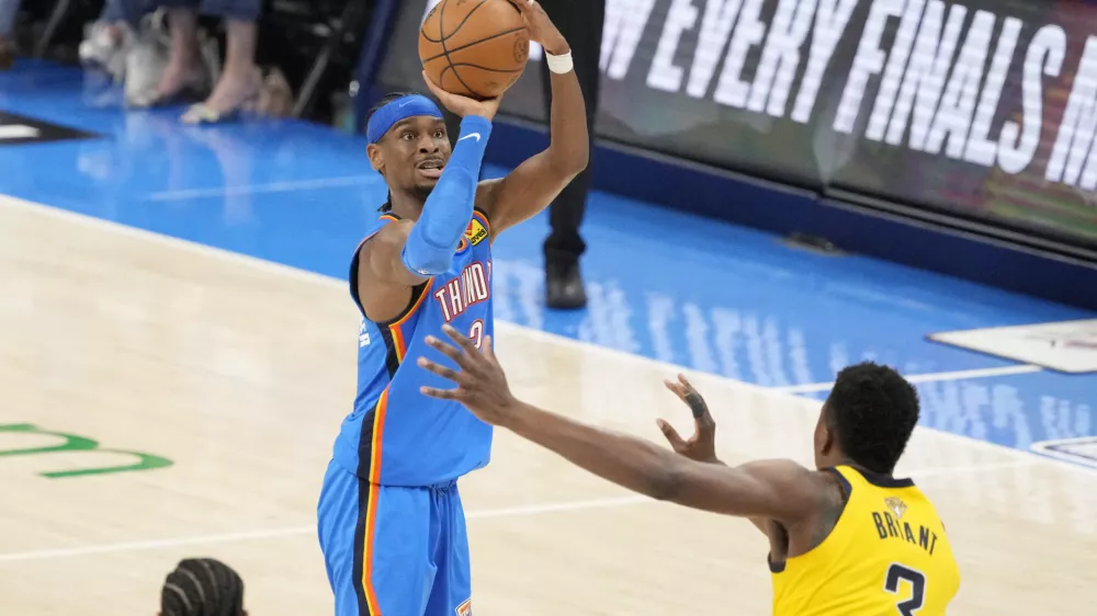 Jun 8, 2025; Oklahoma City, Oklahoma, USA; Oklahoma City Thunder guard Shai Gilgeous-Alexander (2) shoots the ball against Indiana Pacers center Thomas Bryant (3) during the second half during game two of the 2025 NBA Finals at Paycom Center. Mandatory Credit: Kyle Terada-Imagn Images