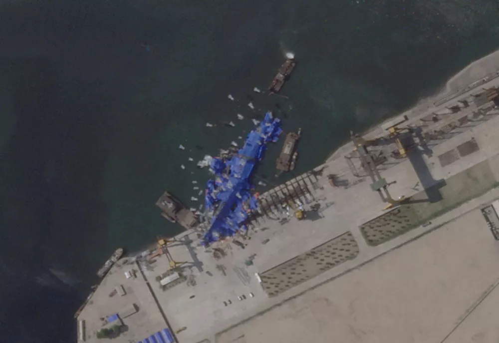 A satellite image shows a North Korean warship covered with a blue tarp after an accident that occurred during its launch at the shipyard in Chongjin, North Korea, May 24, 2025. 2025 Planet Labs PBC/Handout via REUTERS THIS IMAGE HAS BEEN SUPPLIED BY A THIRD PARTY. MANDATORY CREDIT. THIS IMAGE WAS PROCESSED BY REUTERS TO ENHANCE QUALITY.   TPX IMAGES OF THE DAY