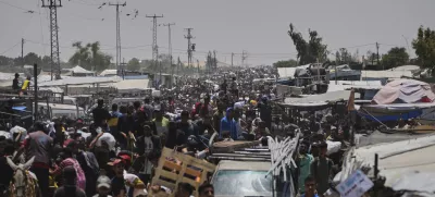 Palestinians heading to receive food and humanitarian aid packages from the Gaza Humanitarian Foundation, a U.S.-backed organization, in Rafah, southern Gaza Strip, Monday, June 9, 2025. (AP Photo/Abdel Kareem Hana)