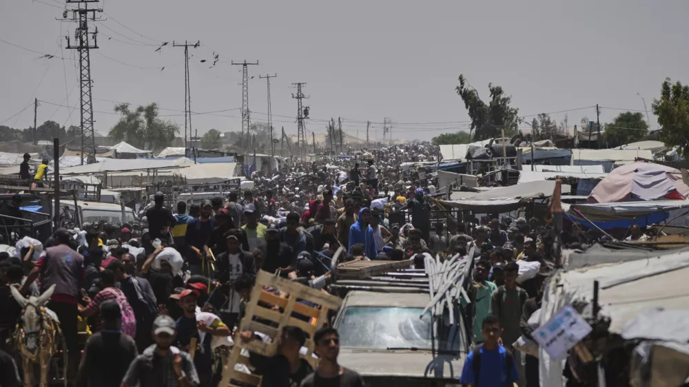 Palestinians heading to receive food and humanitarian aid packages from the Gaza Humanitarian Foundation, a U.S.-backed organization, in Rafah, southern Gaza Strip, Monday, June 9, 2025. (AP Photo/Abdel Kareem Hana)