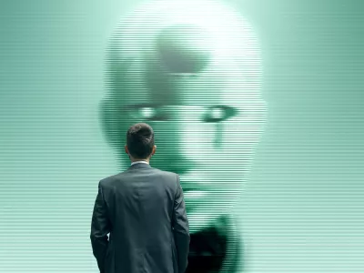 Businessman staring at a humanoid AI robot on a screen, Artificial Intelligence and sci-fi concept / Foto: Istock