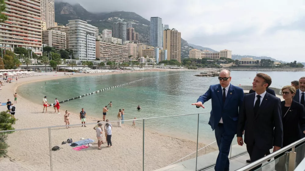 France's President Emmanuel Macron and Prince Albert II of Monaco walk on the seaside after visiting the 'thalassothermic' marine thermal energy company SeaWergie during a two-day state visit in Monaco ahead of the Unoc3, on June 8, 2025. LUDOVIC MARIN/Pool via REUTERS