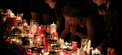 People light candles in the main square following a deadly school shooting in Graz, Austria, June 10, 2025. REUTERS/Leonhard Foeger