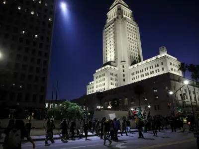 Demonstrators march outside the Los Angeles City Hall, as protests against federal immigration sweeps continue, in downtown Los Angeles, California, U.S. June 10, 2025. REUTERS/Leah Millis