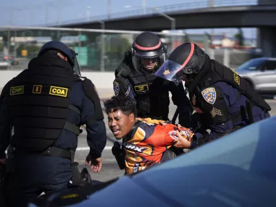 A protester is arrested by California Highway Patrol near the federal building in downtown Los Angeles on Tuesday, June 10, 2025. (AP Photo/Eric Thayer)