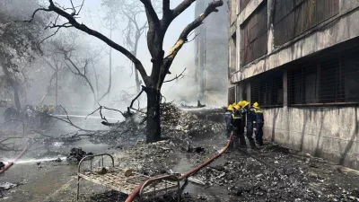 Firefighters work at the site of an airplane that crashed in India's northwestern city of Ahmedabad in Gujarat state, Thursday, June12, 2025. (AP Photo/Ajit Solanki)