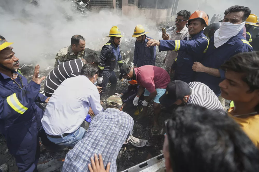 Rescuers work at the site of an airplane that crashed in India's northwestern city of Ahmedabad in Gujarat state, Thursday, June12, 2025. (AP Photo/Ajit Solanki)