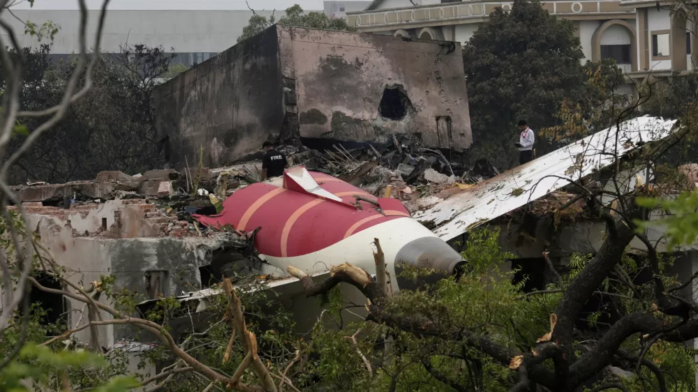 Parts of an Air India plane that crashed on Thursday are seen on top of a building in Ahmedabad, India, Friday, June 13, 2025. (AP Photo/Rafiq Maqbool)
