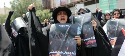 People attend an anti-Israeli protest following the Israeli strikes on Iran, in Tehran, Iran, June 13, 2025. Majid Asgaripour/WANA (West Asia News Agency) via REUTERS  ATTENTION EDITORS - THIS PICTURE WAS PROVIDED BY A THIRD PARTY