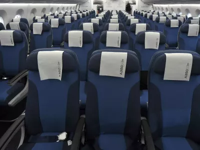 Rows of seats, installed on board of an Airbus A350 XWB flight-test aircraft, are pictured during a media-day at the German headquarters of aircraft company Airbus in Hamburg-Finkenwerder, April 7, 2014. European planemaker Airbus unveiled on Monday the first cabin for its new mid-sized twin-engined airliner, the A350 XWB, vowing to avoid a repeat of the delays caused by cabin design changes on its bigger A380 super jumbo. REUTERS/Fabian Bimmer (GERMANY - Tags: TRANSPORT TRAVEL)