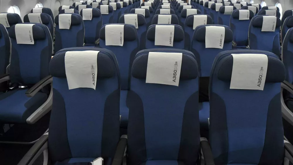 Rows of seats, installed on board of an Airbus A350 XWB flight-test aircraft, are pictured during a media-day at the German headquarters of aircraft company Airbus in Hamburg-Finkenwerder, April 7, 2014. European planemaker Airbus unveiled on Monday the first cabin for its new mid-sized twin-engined airliner, the A350 XWB, vowing to avoid a repeat of the delays caused by cabin design changes on its bigger A380 super jumbo. REUTERS/Fabian Bimmer (GERMANY - Tags: TRANSPORT TRAVEL)