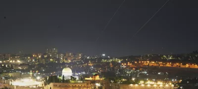 Traces are seen over Jerusalem during a missile attack alert, Friday, June 13, 2025. (AP Photo/Ohad Zwigenberg)