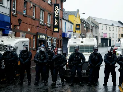 Police block a road during the fourth evening of unrest, following a protest over an alleged sexual assault in Ballymena on a teenage girl, in Portadown, Northern Ireland, June 12, 2025. REUTERS/Clodagh Kilcoyne. REFILE - CORRECTING SUBJECT LOCATION FROM "LOCAL" TO "IN BALLYMENA".