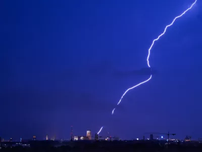 FILED - 01 August 2017, Bavaria, Munich: A strike of lightning appears over the Munich skyline in the state of Bavaria. Three climbers died after being struck by lightning while hiking in Austria's Tyrol region at the weekend. Photo: picture alliance / Peter Kneffel/dpa