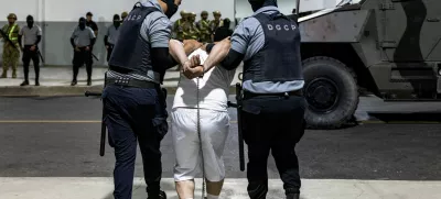 Salvadoran prison guards escort a man as the alleged members of the Venezuelan gang Tren de Aragua and the MS-13 gang recently deported by the U.S. government are to be imprisoned in the Terrorism Confinement Center (CECOT) prison, in Tecoluca, El Salvador April 12, 2025. Secretaria de Prensa de la Presidencia/Handout via REUTERS ATTENTION EDITORS-THIS IMAGE HAS BEEN SUPPLIED BY A THIRD PARTY. NO RESALES. NO ARCHIVES.