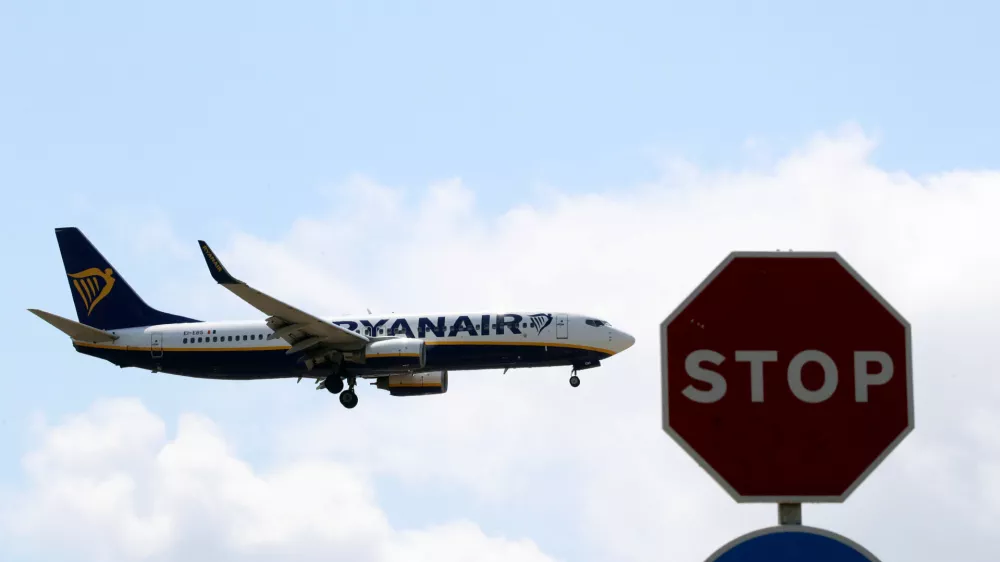 A Ryanair airplane passes a Stop sign as it lands at Barcelona-El Prat airport, the day before a cabin crew strike is to be held in European countries, in Barcelona, Spain, July 24, 2018. REUTERS/Albert Gea