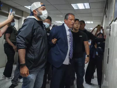 New York City Comptroller Brad Lander is placed under arrest by Immigration and Customs Enforcement (ICE) and FBI agents outside federal immigration court on Tuesday, June 17, 2025, in New York. (AP Photo/Olga Fedorova)