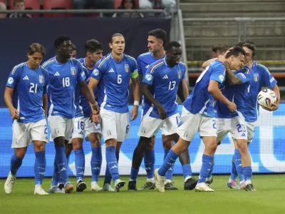 Italian players celebrate after scoring during the group A European U-20 Championship soccer match between Spain and Italy in Trnava, Slovakia, Tuesday, June 17, 2025. (AP Photo/Petr David Josek)